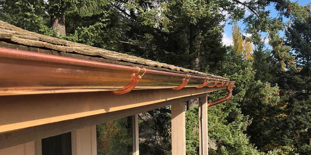 Beautiful copper half-round gutters installed by Royal Gutters in Portland