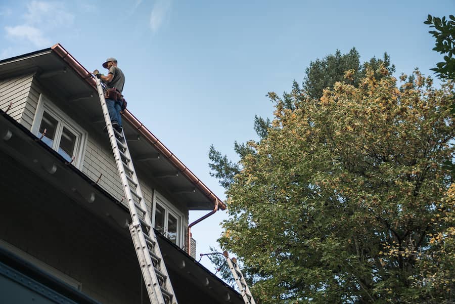 Royal Gutters Team Installing End Caps and Miters